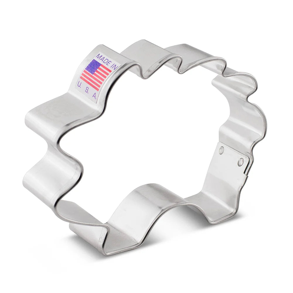 Metal hedgehog-shaped cookie cutter with a "Made in USA" label attached.