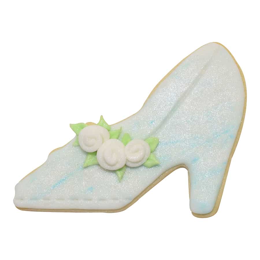 Decorated high heel cookie with light blue icing, floral accents, and shimmer details.