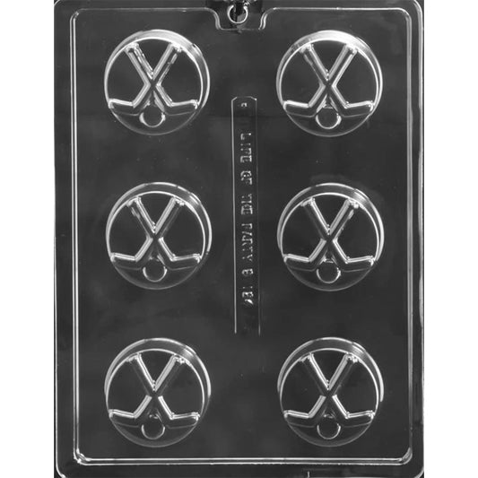 Clear plastic chocolate-covered cookie mold with six round cavities, each featuring raised crossed hockey sticks and a puck design.