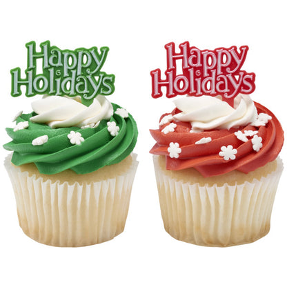 Two cupcakes with green and red icing, each topped with a “Happy Holidays” pick and white snowflake sprinkles.