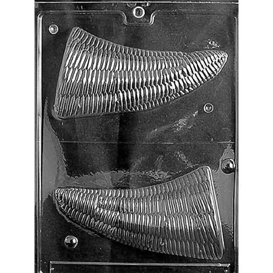 Clear plastic 3D chocolate mold photographed on a black background with two large cornucopia half cavities, each with ribbed basket-weave texture and a curved horn shape.