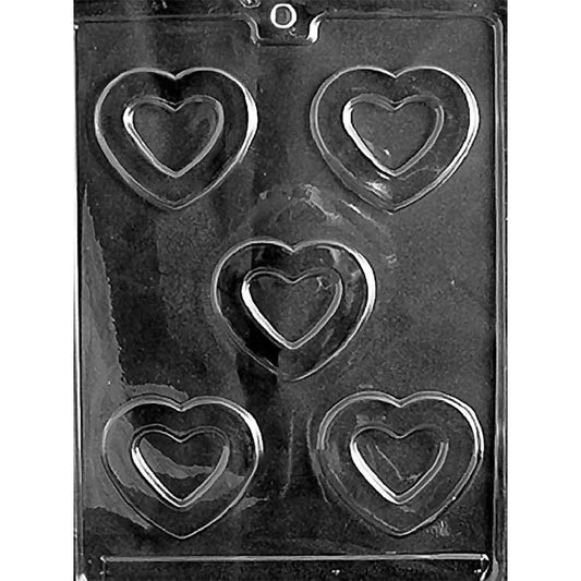 Clear plastic chocolate mold with five heart-shaped cavities, each featuring a smaller raised heart inside a larger open heart outline.