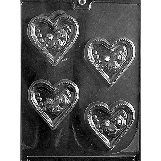 Clear Hollow Hearts With Roses Chocolate Mold photographed against a black background with four heart-shaped cavities featuring open centers, rose details, and dotted borders.