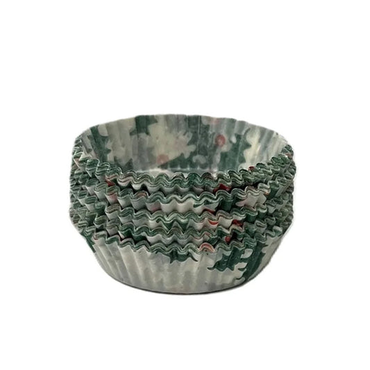 Stack of holly-patterned candy cups with green holiday print and fluted accordion sides, shown nested together on a white background.