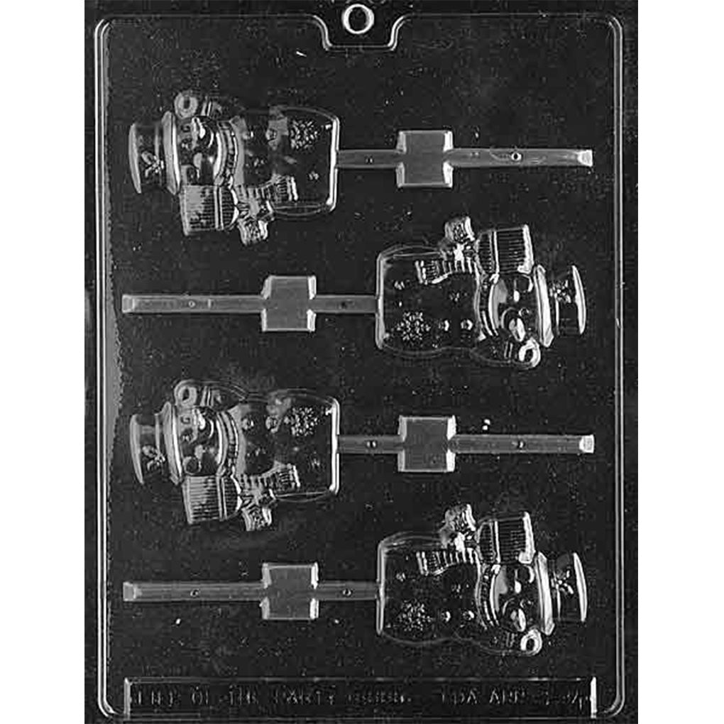 Clear plastic chocolate lollipop mold with four snowman cavities wearing wide-brim hats with holly, earmuffs, scarves, and holding brooms, with stick channels on a dark background.