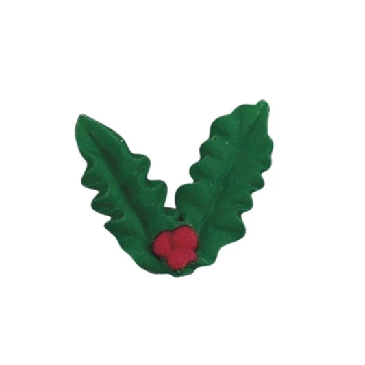 Green holly leaf royal icing decoration with two leaves and a small cluster of red berries, photographed on a white background.
