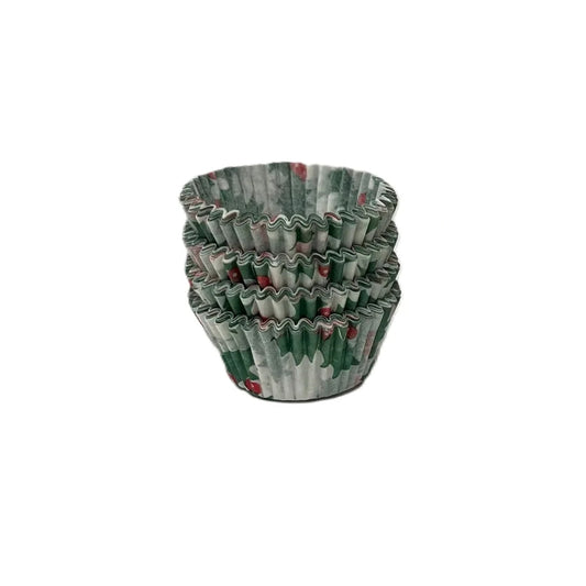 Stack of holly-print paper candy cups with green leaves and red berries.