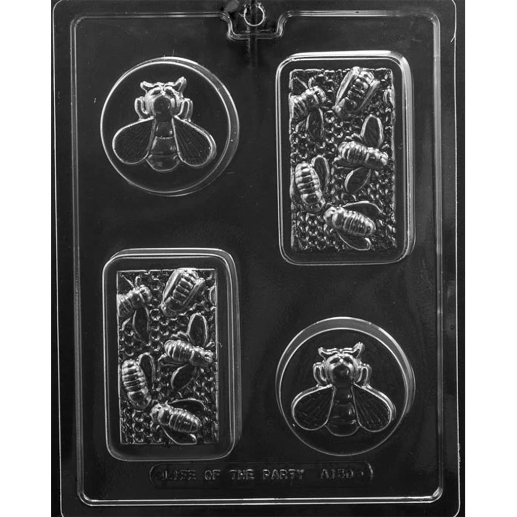 Clear plastic chocolate mold on a black background with two round cavities featuring a raised honeybee design and two rectangular cavities with a honeycomb and bee pattern.