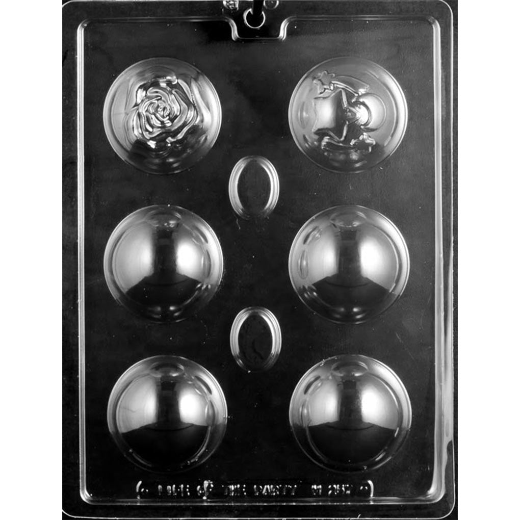 Clear plastic hot cocoa bomb mold with four smooth half-sphere cavities, one large rose design, and one star-and-moon design with shooting stars