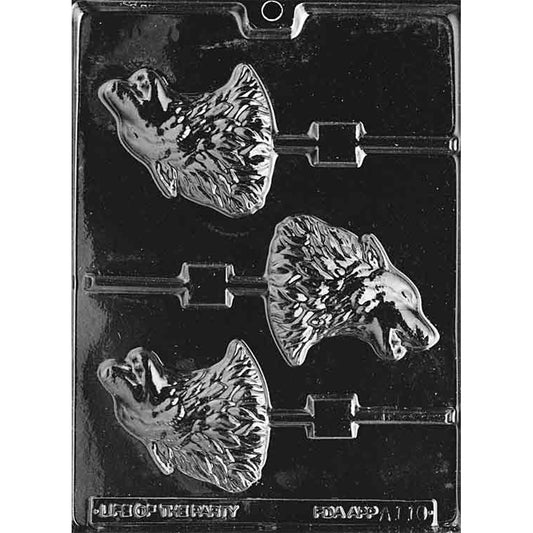 Clear plastic chocolate lollipop mold with three howling wolf head cavities, each showing a raised wolf profile with textured fur and an open mouth, plus stick channels.