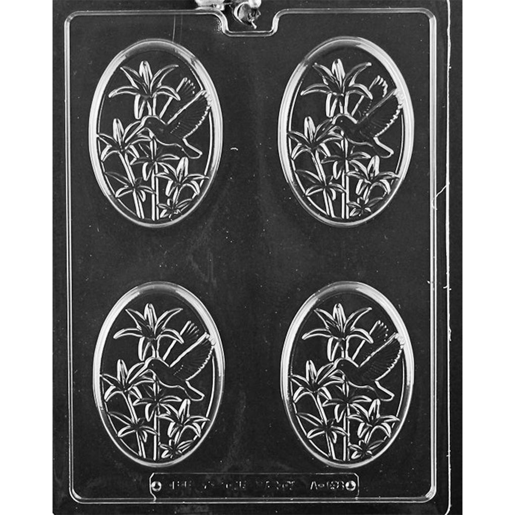Chocolate mold with 4 oval cavities featuring a hummingbird flying among lily flowers