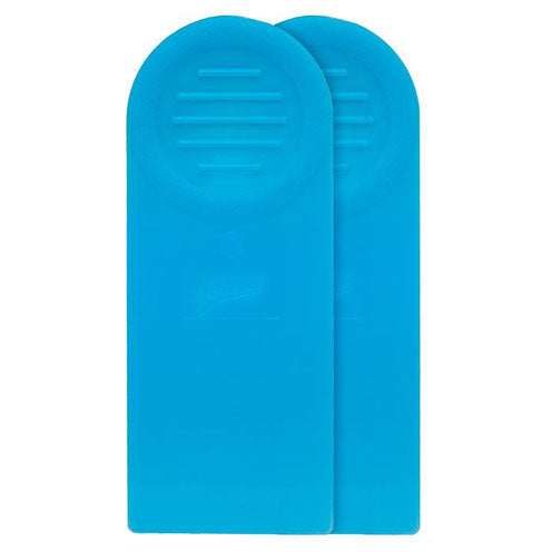 Two blue icing spreaders with tapered flexible tips for smoothing, spreading, and cake stenciling.