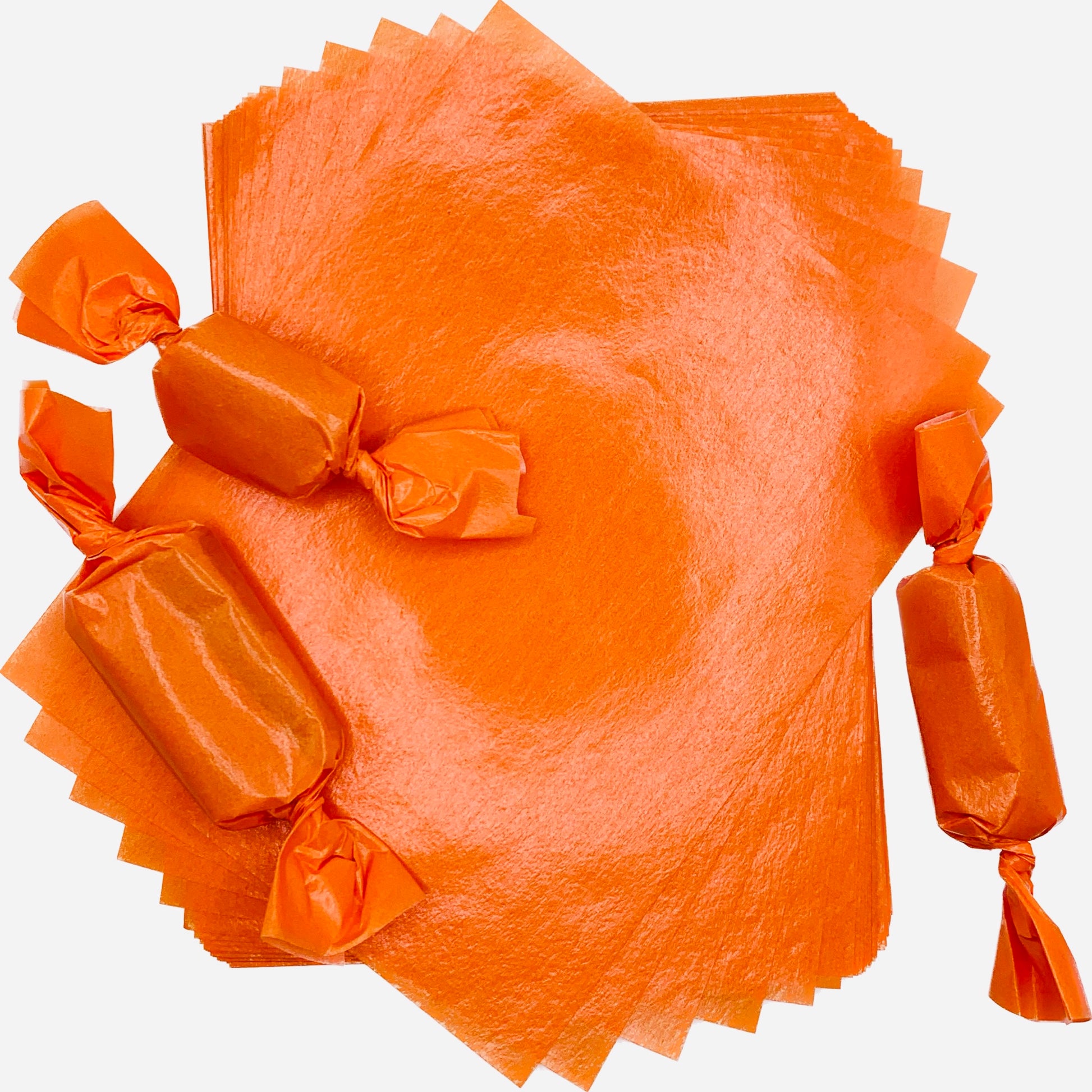 Orange Wax Caramel Candy Wrappers with Three Pieces of Wrapped Candy