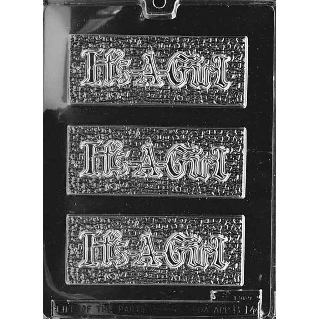 Clear plastic chocolate bar mold photographed on a black background with three rectangular bar cavities, each showing raised “It’s a Girl” lettering on a textured background.