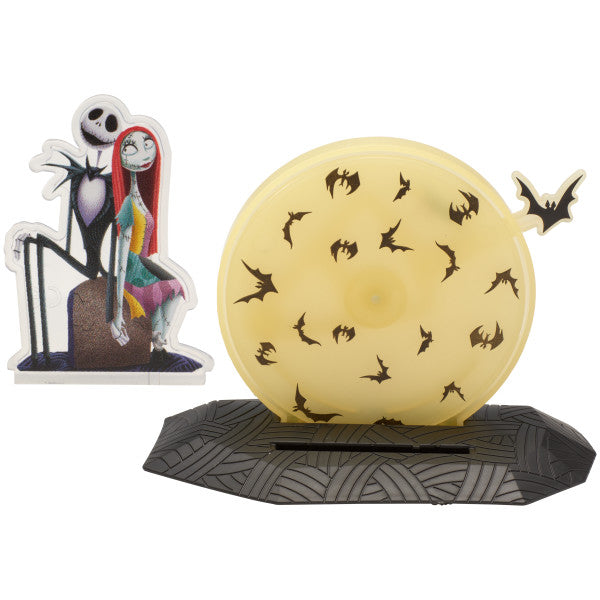  Two-piece cake topper set featuring Jack and Sally in front of a yellow moon with black bats, with a detachable background.