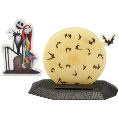 Two-piece cake topper set featuring Jack and Sally in front of a yellow moon with black bats, with a detachable background.