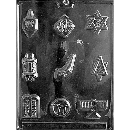 Clear plastic chocolate mold with assorted Jewish symbol cavities including a dreidel, Shalom plaque, Star of David, Torah scroll, shofar, Chai symbol, Ten Commandments, and menorah.
