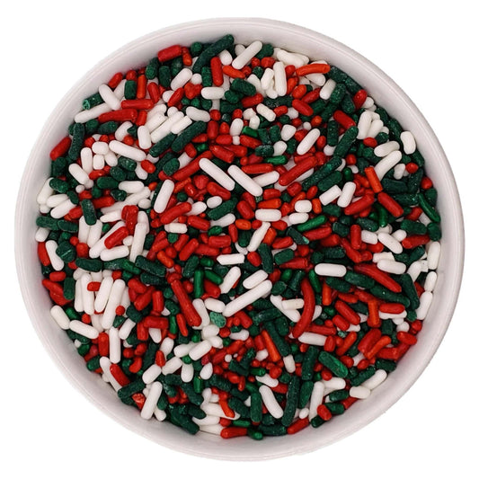 Bowl filled with red, green, and white jimmies sprinkles for Christmas baking and decorating.