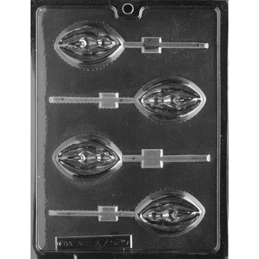Clear plastic adult chocolate lollipop mold photographed against a black background with four oval cavities featuring sculpted vulva designs and built-in lollipop stick channels.