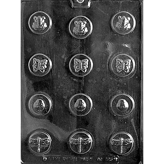 Clear plastic chocolate mold photographed on a dark background with twelve small round cavities, each embossed with a ladybug, butterfly, or dragonfly design arranged in rows.
