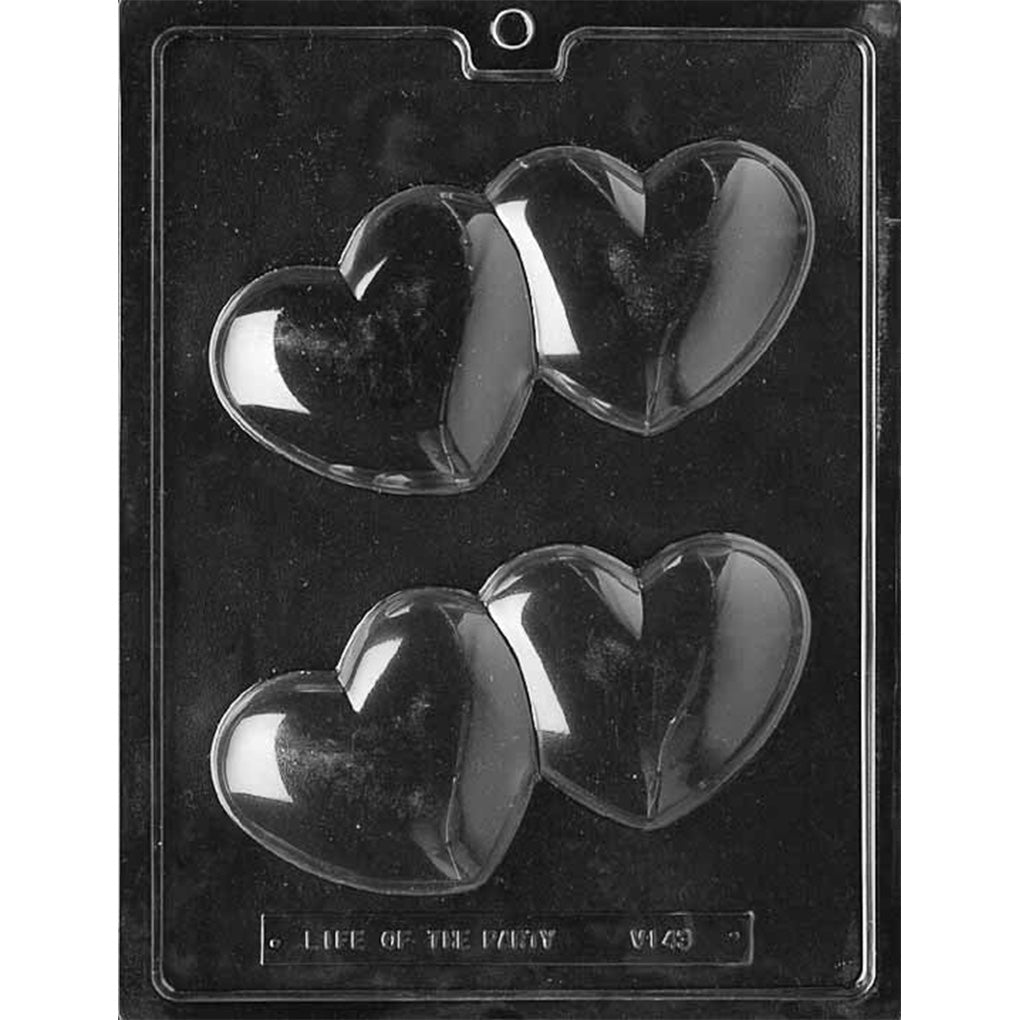Clear plastic chocolate mold with two large overlapping heart cavities on one tray.