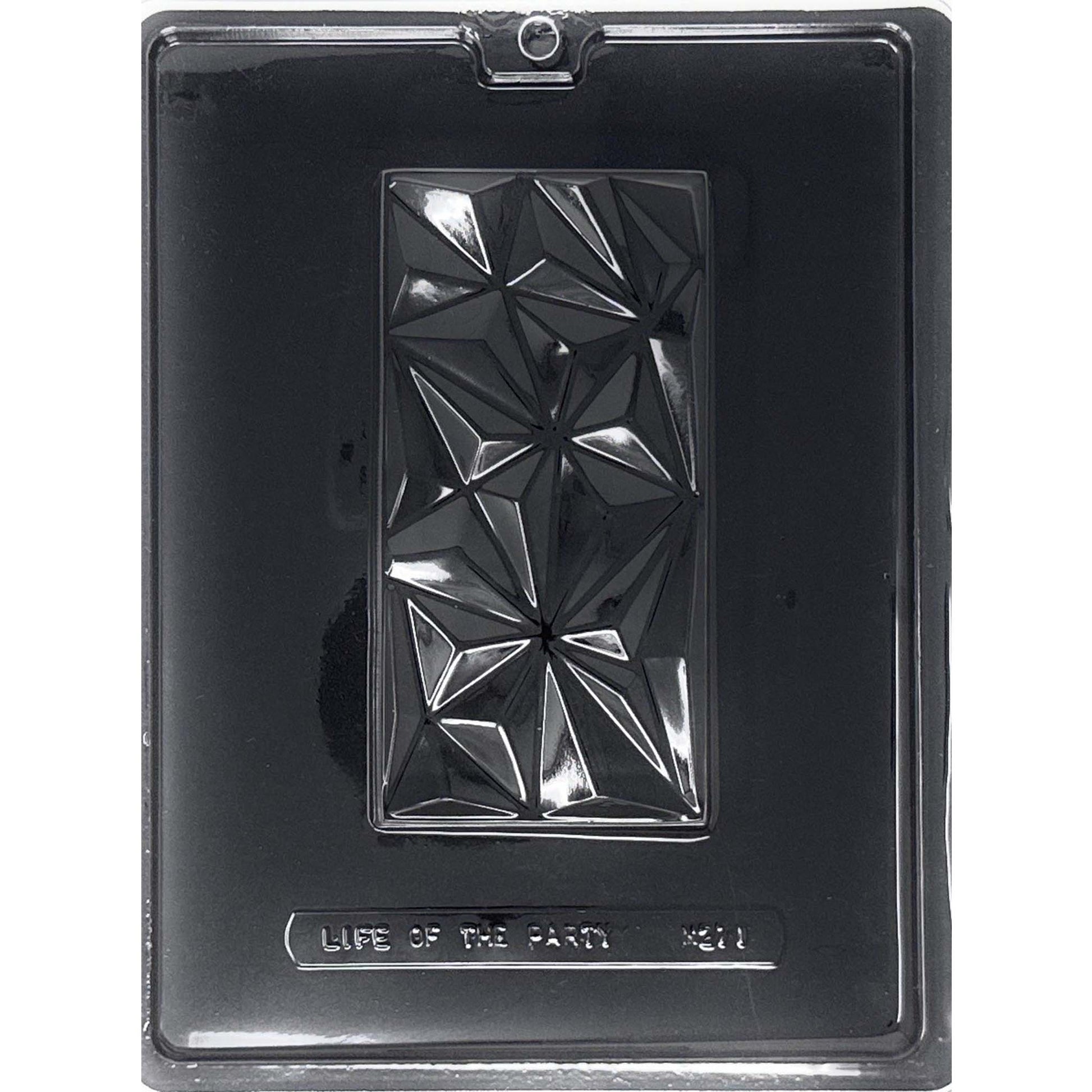 Clear Large Dubai Chocolate Bar Mold photographed against a black background, featuring one deep rectangular bar cavity covered with an angular faceted geometric pattern.