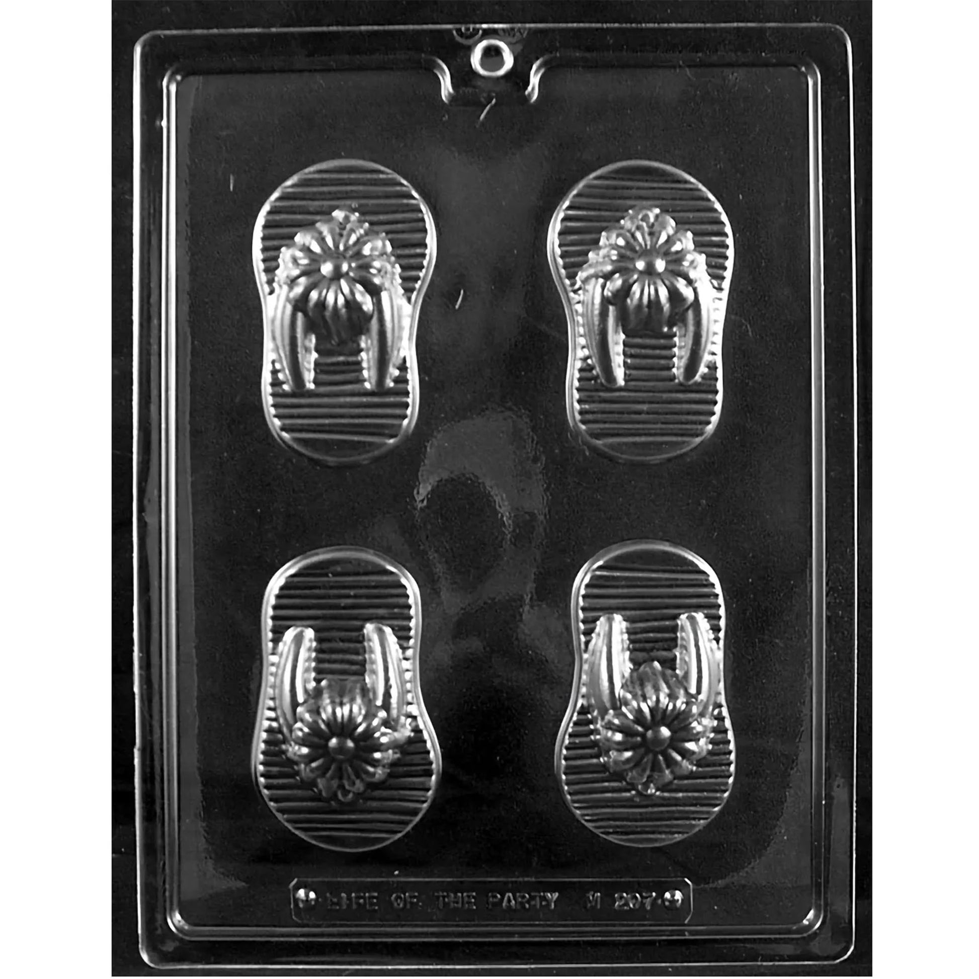 Clear plastic chocolate mold tray with four large flip-flop cavities featuring a flower strap and ridged sole pattern.