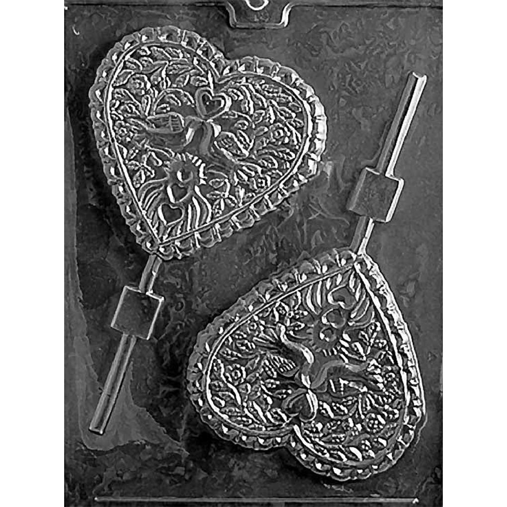 Chocolate lollipop mold with two large heart cavities featuring pairs of doves, flowers, leafy vines, ruffled borders, and stick channels