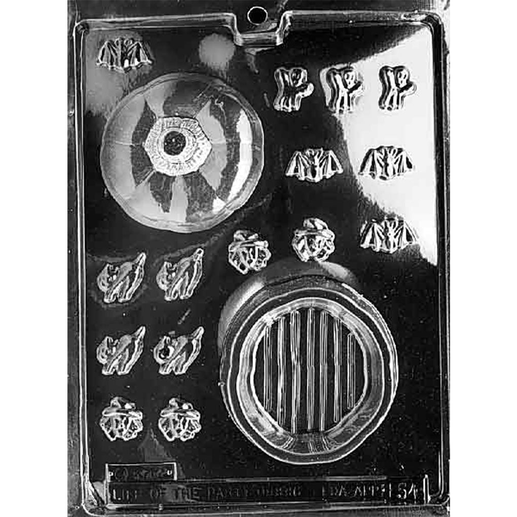 Clear Large Pumpkin Pour Box Chocolate Mold photographed against a black background with pumpkin lid and base cavities plus assorted bite-size bats, cats, witches, and ghosts.