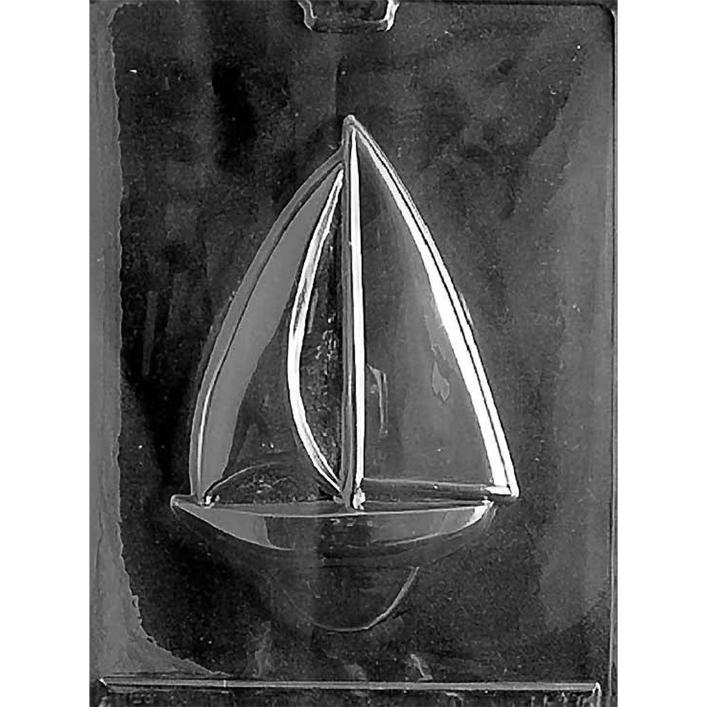 Clear plastic chocolate mold with a large sailboat cavity showing a curved hull and two sails.