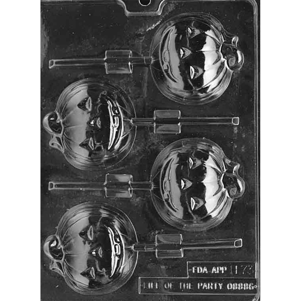Clear plastic chocolate lollipop mold with four large round pumpkin face cavities featuring a smiling jack-o’-lantern expression and curly vine detail, with stick channels, photographed on a black background.