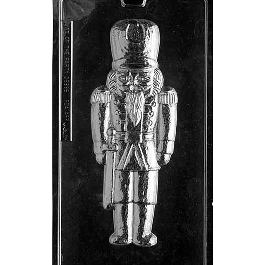 Clear plastic chocolate mold with one large toy soldier cavity showing a tall hat, beard, jacket, belt, and boots for casting a Nutcracker-style soldier chocolate.