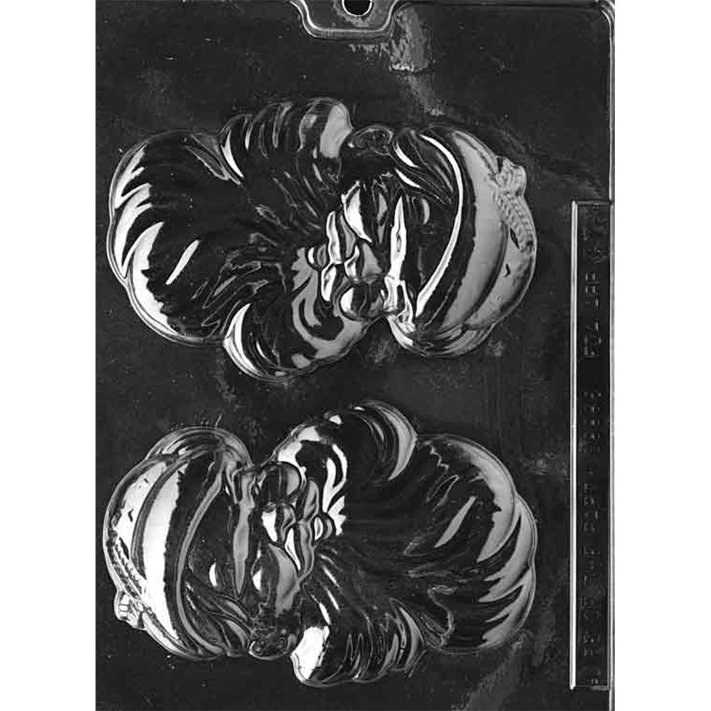 Clear plastic chocolate mold with two large Santa head cavities featuring a rosy-cheeked face, curled beard, and hat details, shown on a dark background for contrast.