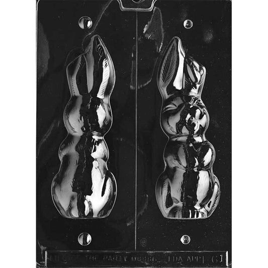 Clear plastic hollow 3D chocolate mold with a vertical center cut line, showing a large laughing bunny figure with squinted eyes and one floppy ear, arranged as matching halves on a dark background.