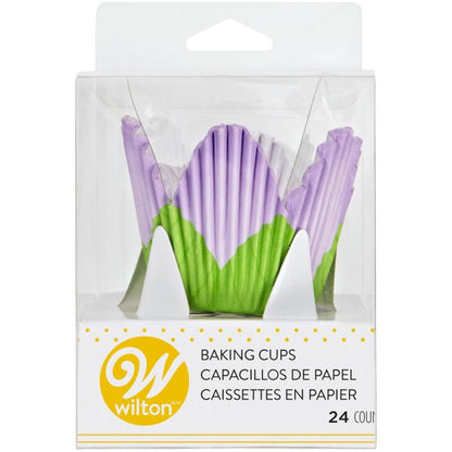 Clear plastic package of Wilton petal baking cups showing lavender and green petal-shaped cups inside, labeled “Baking Cups” with 24 count.