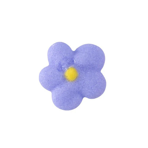 Lavender royal icing drop flower with a yellow center on a white background.