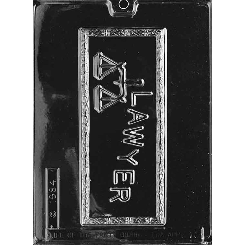 Clear plastic chocolate bar mold with one large rectangular cavity featuring raised “LAWYER” lettering and a scales-of-justice icon inside a bordered frame on a dark background.