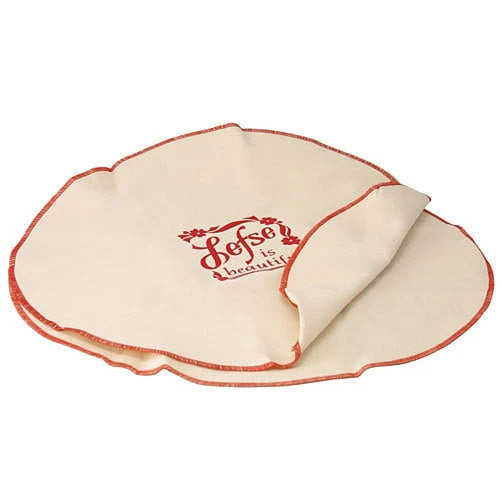 Two round lefse cooling cozies made from natural-colored cotton with red stitched edging; one cozy shows red “Lefse is Beautiful” text in the center, shown partially folded.