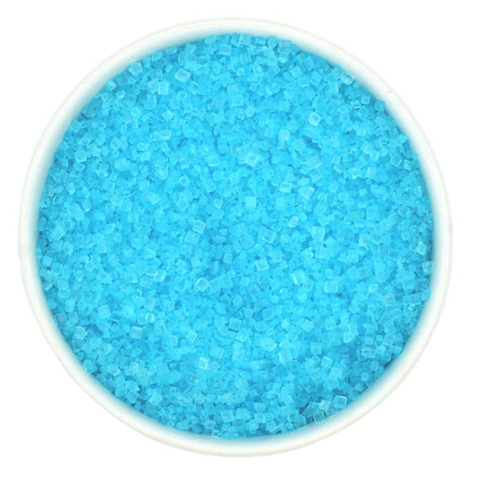 Top-down view of a white bowl filled with light blue coarse sanding sugar crystals, showing chunky sparkling granules in a pale icy-blue color.