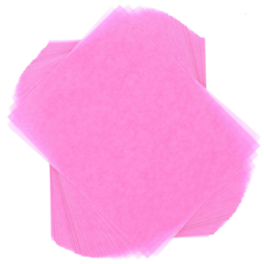 Two overlapping, fanned stacks of light pink 4" x 5" wax caramel and taffy wrapper sheets displayed against a white background.