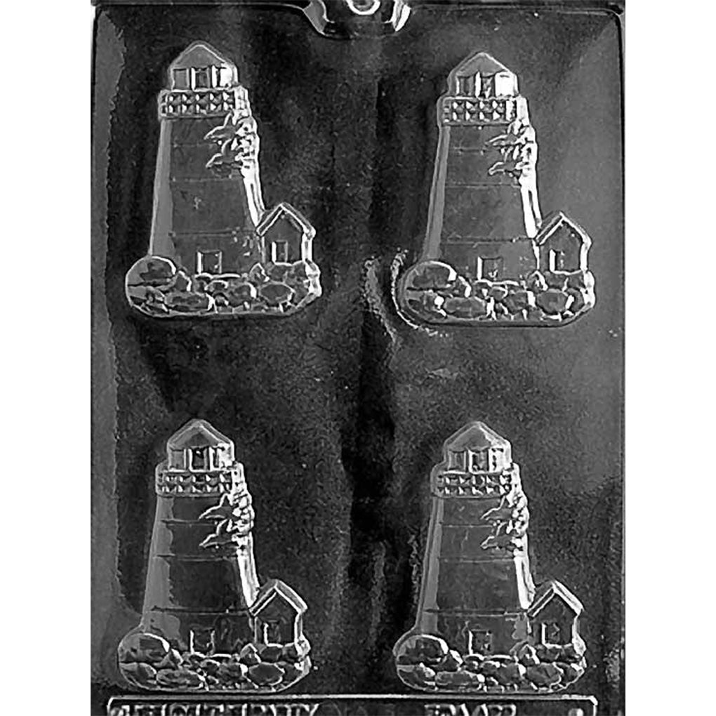 Clear plastic chocolate mold with four lighthouse-shaped cavities showing a tall lighthouse tower on a rocky shoreline with a small keeper’s house beside it.