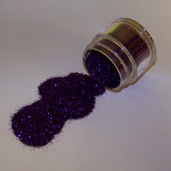Deep violet Galaxy Glitter Dust flowing from a clear container, sparkling with intense purple shimmer and flecks of blue.