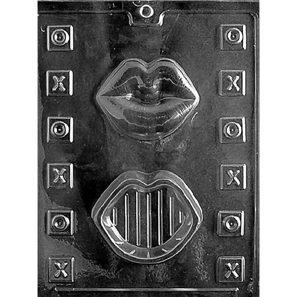 Clear Lips Pour Box Chocolate Mold photographed against a black background with 2 large lip-shaped box cavities and 12 small square X and O candy cavities.