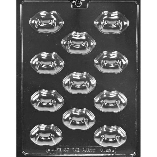 Clear chocolate mold with multiple lip-shaped cavities, each featuring pointed vampire fangs.