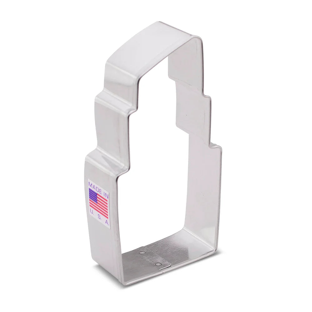 Silver lipstick-shaped cookie cutter with "Made in USA" label.