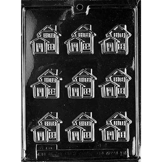 Clear plastic chocolate mold with nine bite-sized house-shaped cavities featuring door and window details for making miniature chocolate houses.