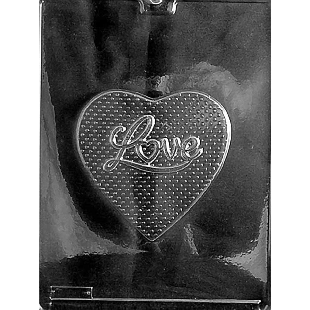 Plastic chocolate mold with a large heart cavity featuring raised “Love” script and a dotted texture background.