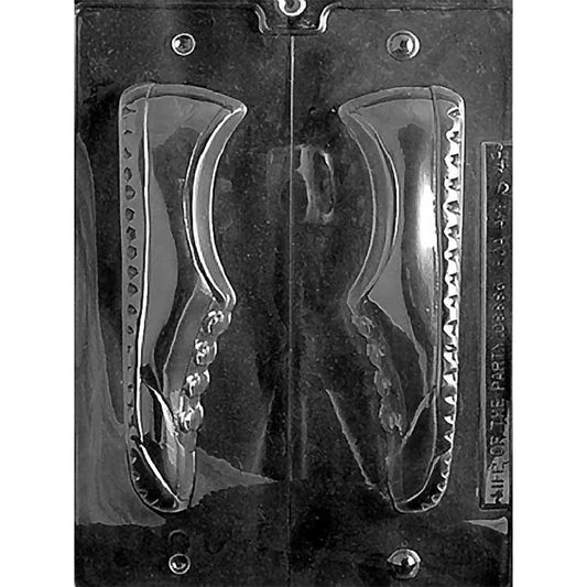 Clear two-piece chocolate mold photographed against a black background, featuring matching sneaker halves with raised laces, side panels, and sole details.