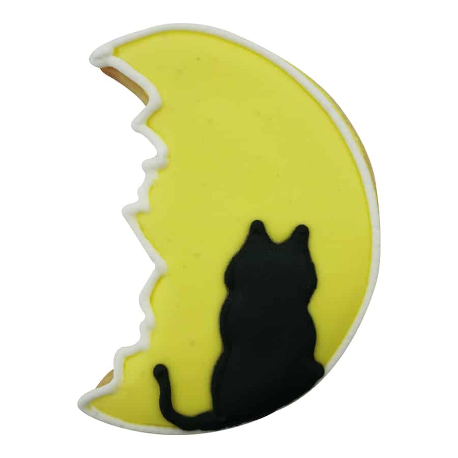 Decorated Man in the Moon cookie with a yellow icing base and a black cat silhouette.