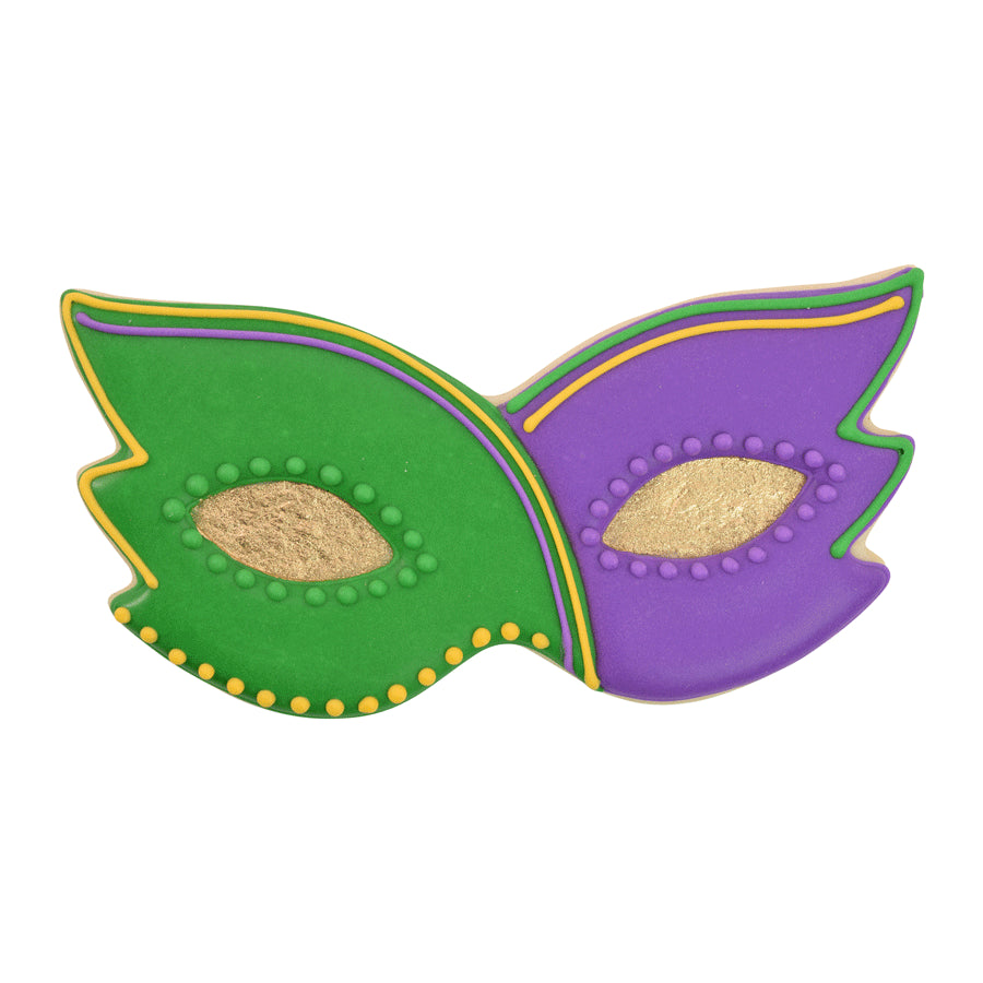 Decorated cookie shaped like a Mardi Gras mask in green and purple with gold accents and festive piping.